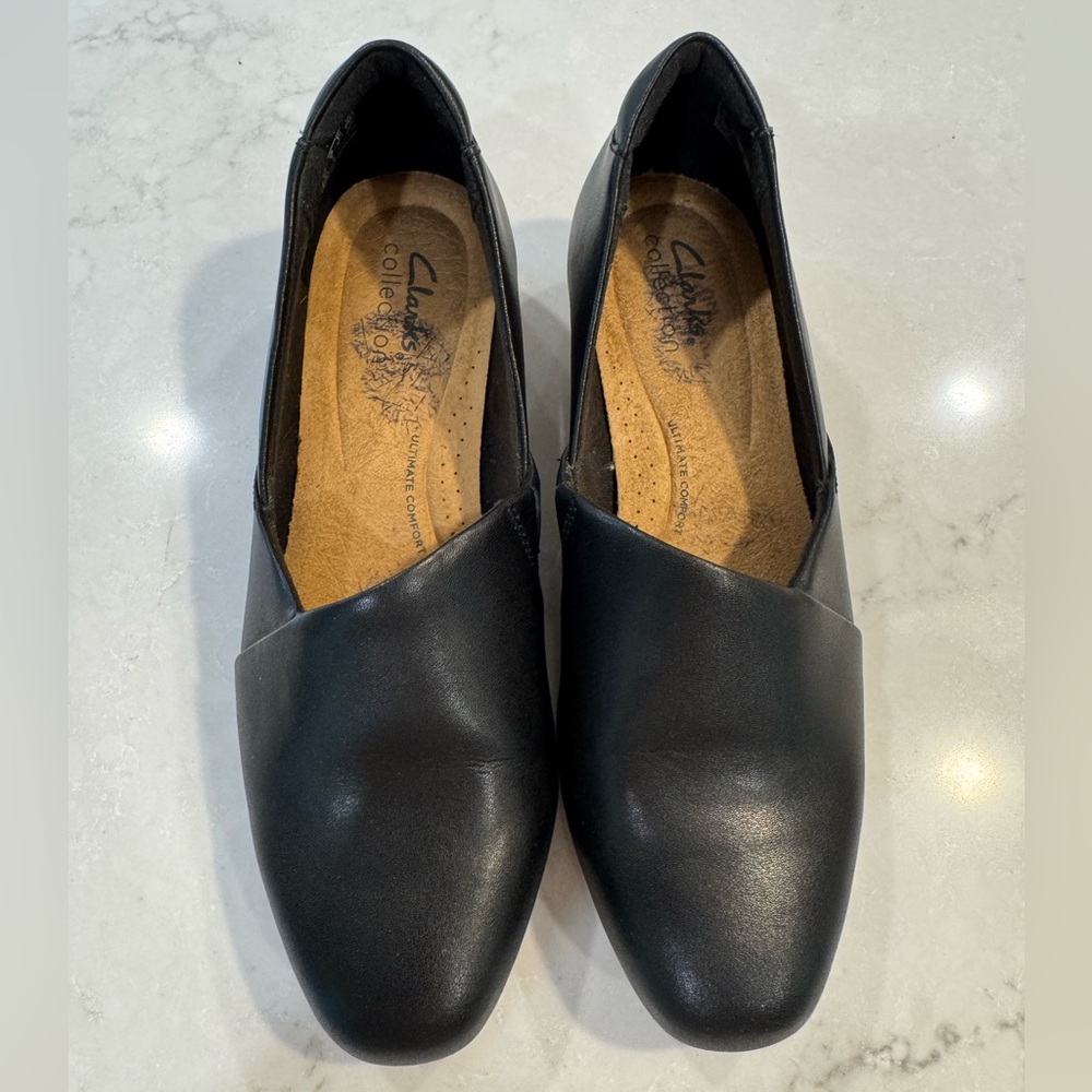 Clarks Black Leather Flats for Versatile Comfort